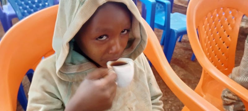 Boy drinking tea