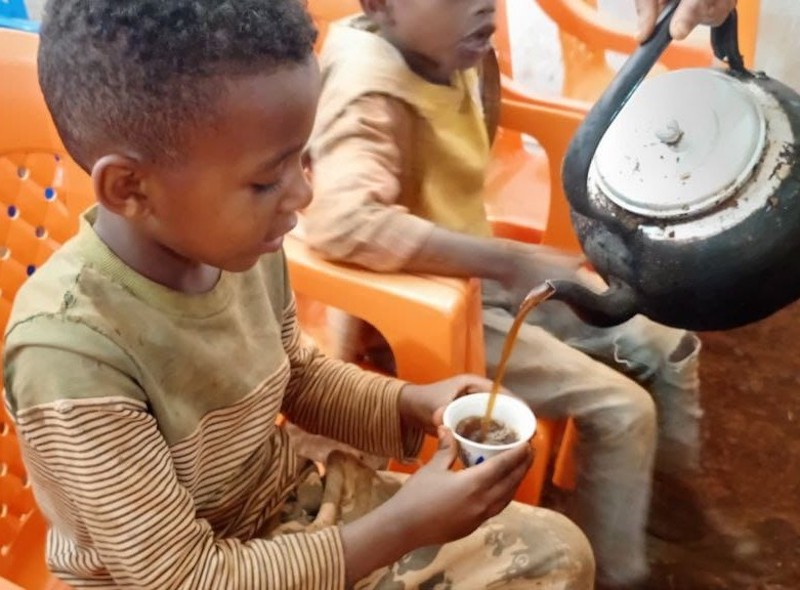 Serving tea to child